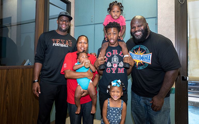 Hometown Football Star Vince Young, WWE's Mark Henry, Visit Harvey Survivors